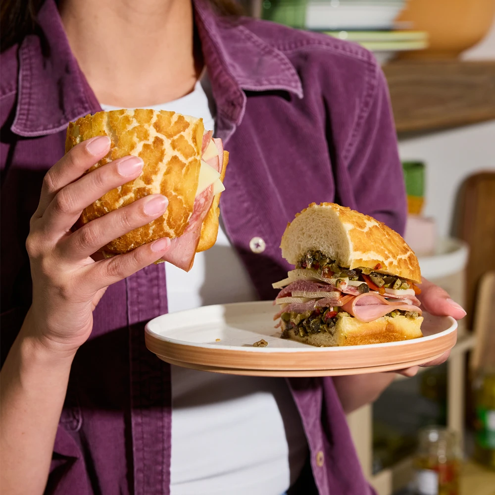 Holding a Dutch Crunch Bread Sando