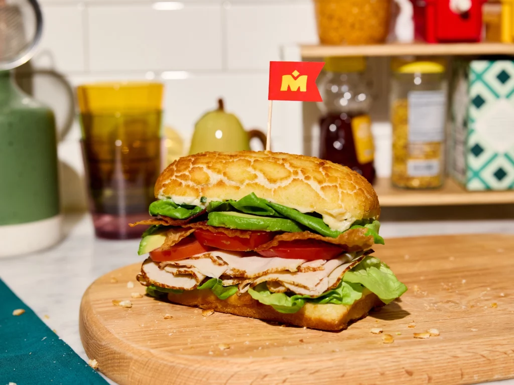 Recipe photo of Turkey Club Sando Sandwich on a plate.